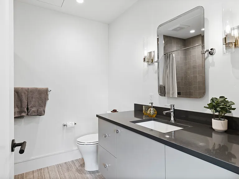 Ensuite Guest Bath (tub and shower). Radiant heated floor
