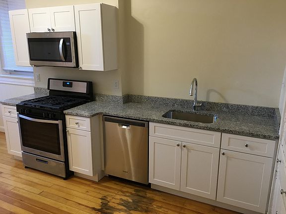 Kitchen with granite countertops and stainless steel appliances.