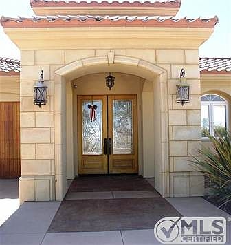 Double front doors leading to private court yard.