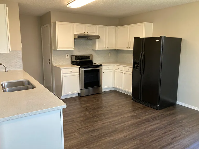 Large kitchen with attached dining area.