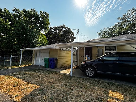 Covered carport and detached garage