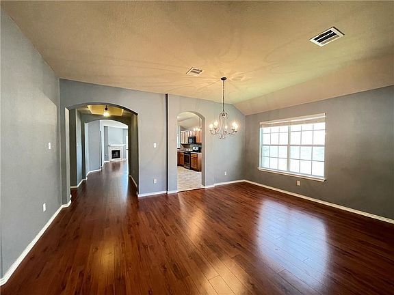 Entry way with a dining area + additional living / family room