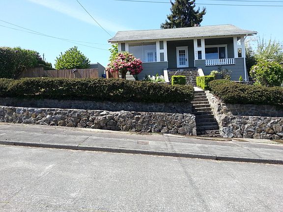1912 craftsman-style home perched high on an over-sized lot