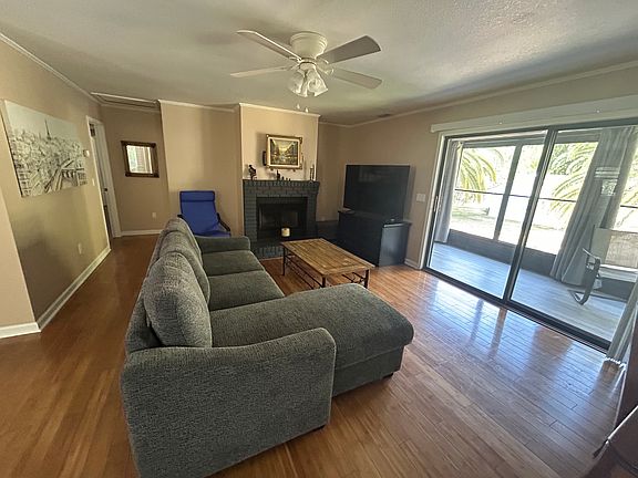 Large living room with 65" TV with a large selection of premium channels