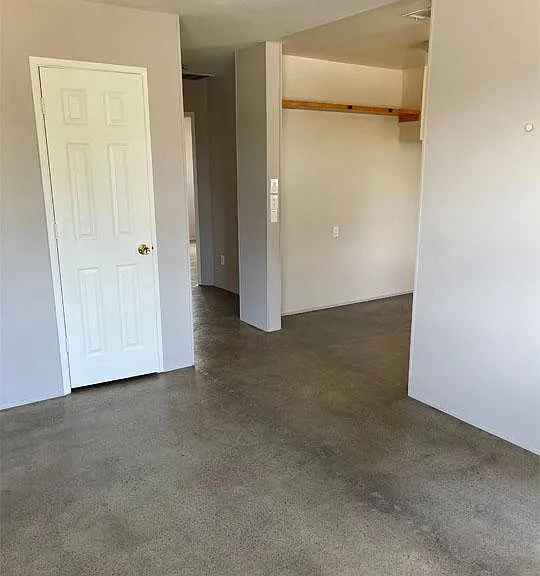 Living Room view toward kitchen. Coat closet in living room.
