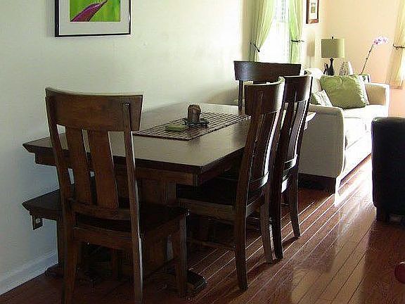 View of dining room / living room from an entry way into the kitchen.