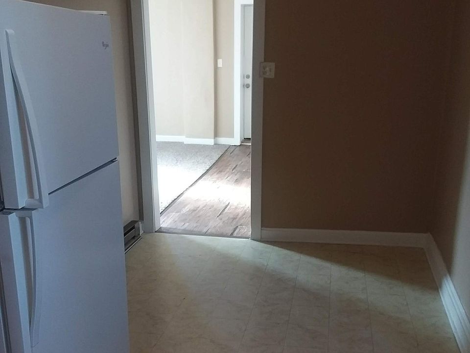 Kitchen - front door and Livingroom through doorway.