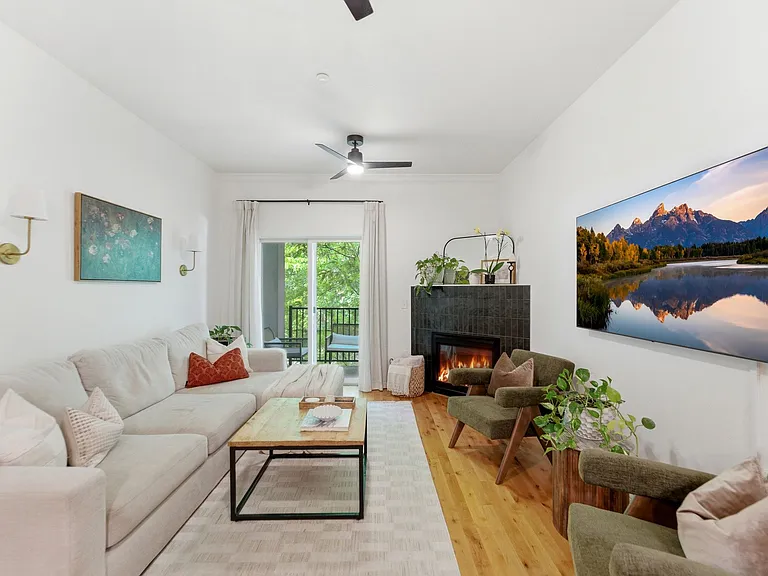 Living room with walk out balcony and gas fireplace