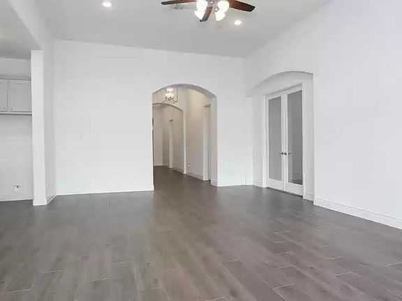 Looking from family room, media room on the right, kitchen on the left