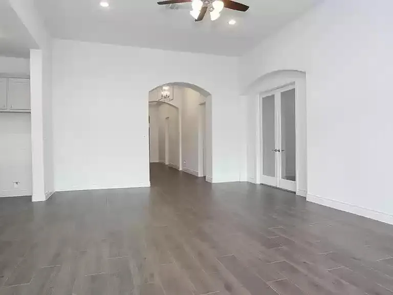 Looking from family room, media room on the right, kitchen on the left