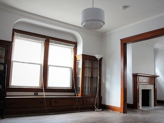 Dining room with built-in glass cabinets and storage