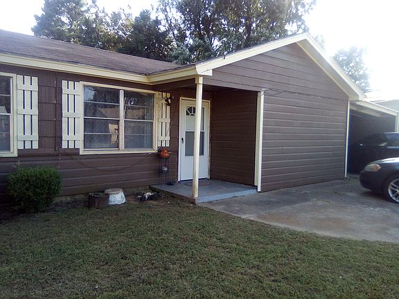 Covered carport w/storage shed