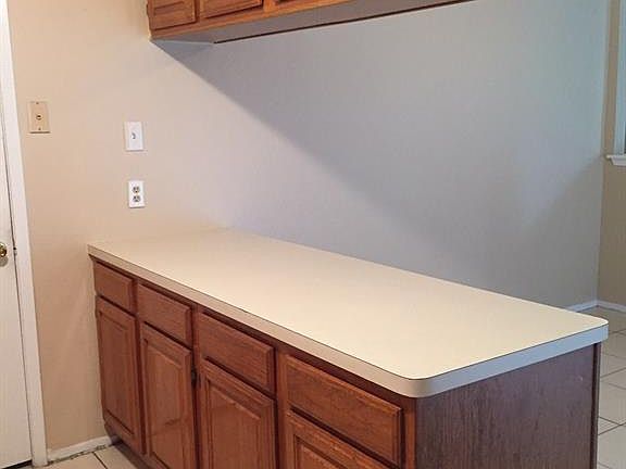More cabinet space in the kitchen. The breakfast area is on the other side.