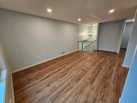 Inviting living space with large windows providing excellent natural light
