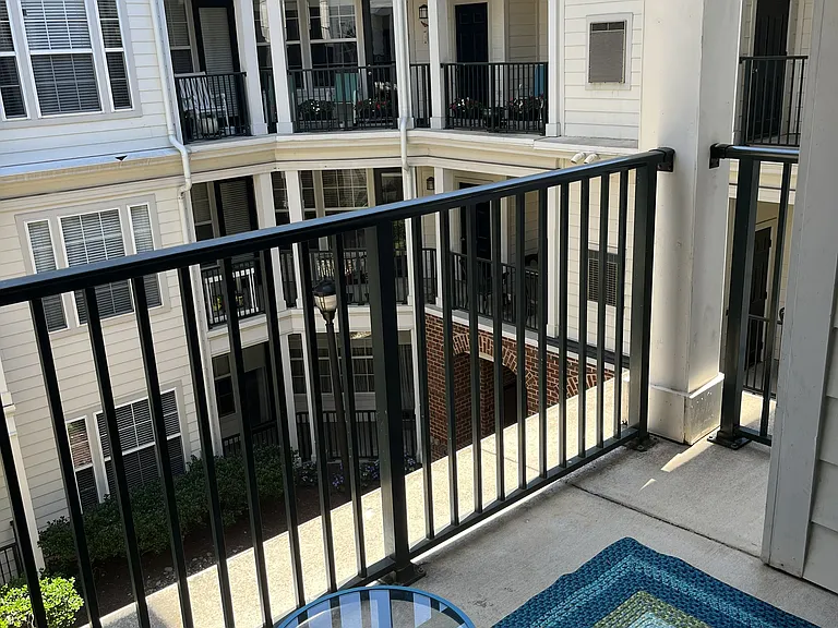 Balcony faces south overlooking quiet courtyard.