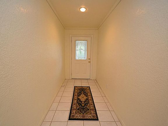  ENTRY... This ELEGANT ENTRY offers tile floors, beveled glass front door and crown molding.