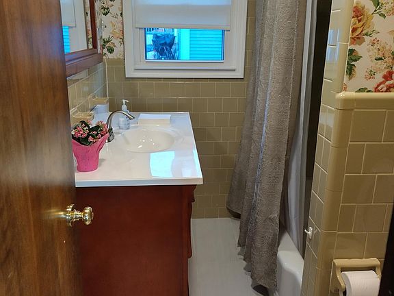 Full tile bathroom with tub.
