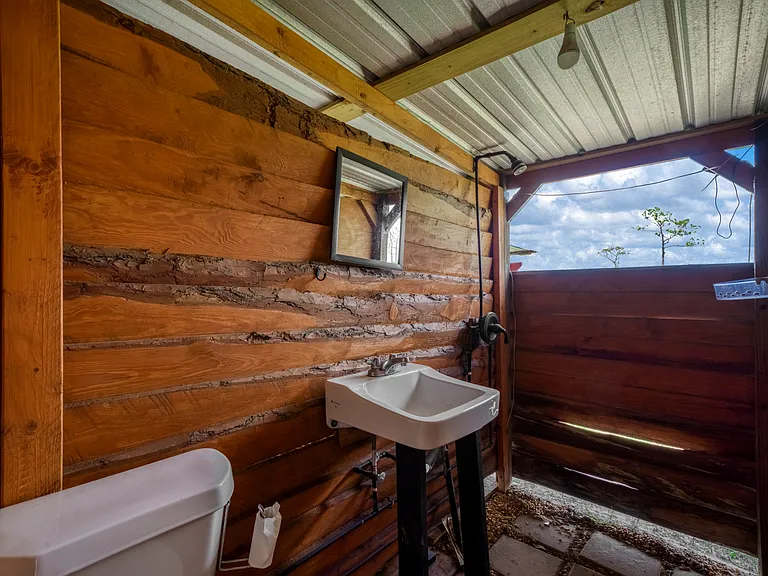 Exterior rustic bathroom of main house
