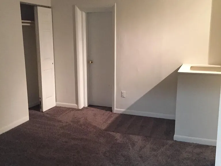 Bedroom with staircase to basement