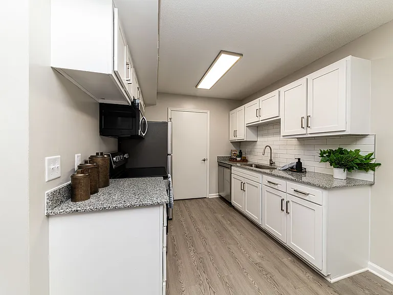 Kitchen with granite counters and modern cabinetry