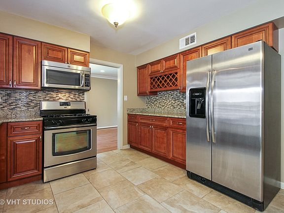 5th image of 9736 S Kolmar Ave