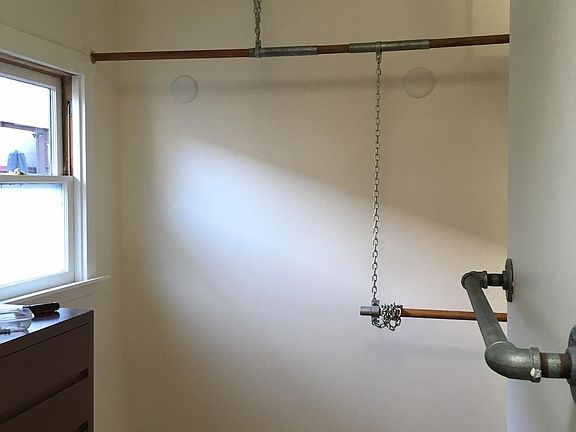 Walk-in closet with window and room for vanity