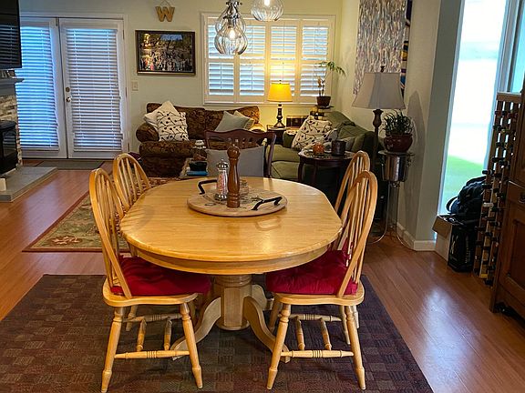 New dining room lighting with dimmer switch, privacy glass on two additional windows in condo due to outside wall end unit.