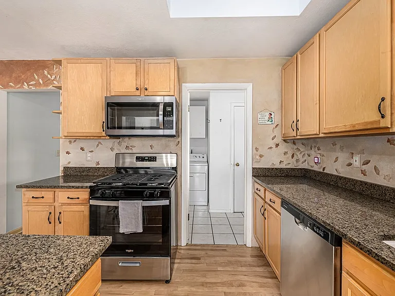 New gas stove, dishwasher and microwave oven.