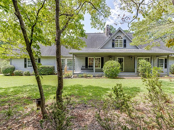 Front porch with swing and wooded view