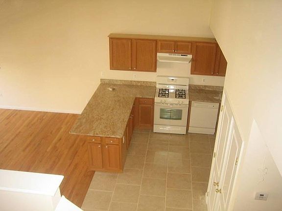 Kitchen with washer and dryer inside closet