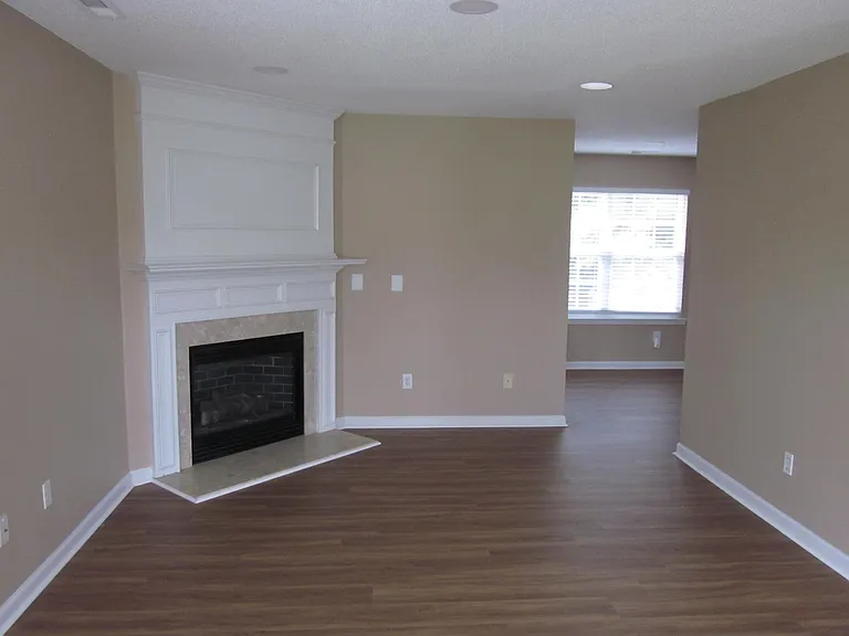 Family Room with newly installed hardwood floor LVP.