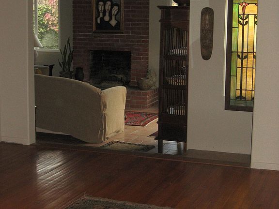 living room to den with fireplace