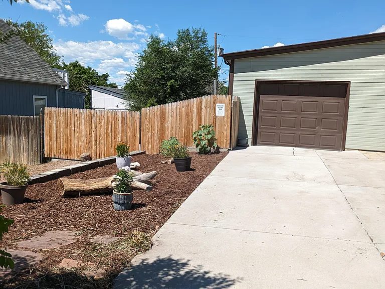 Driveway leading to the attached garage. 2nd driveway is visible to the left.
