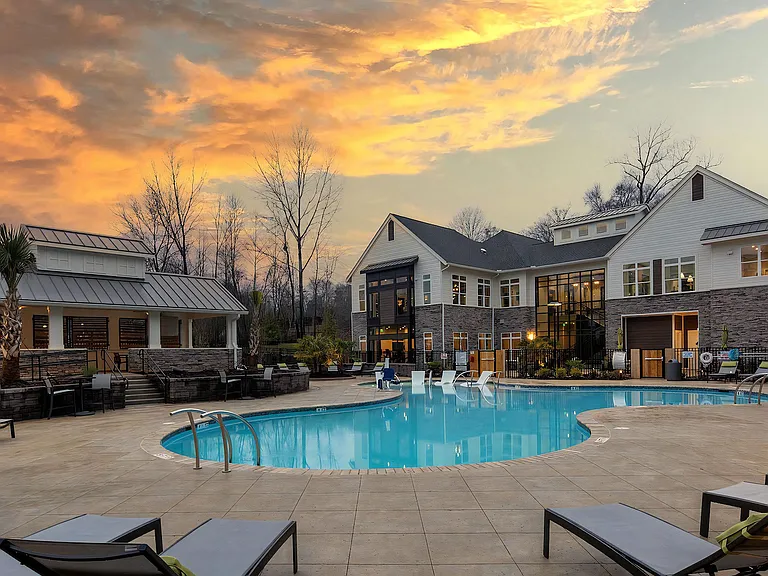 Pool with Clubhouse with Sunset Background