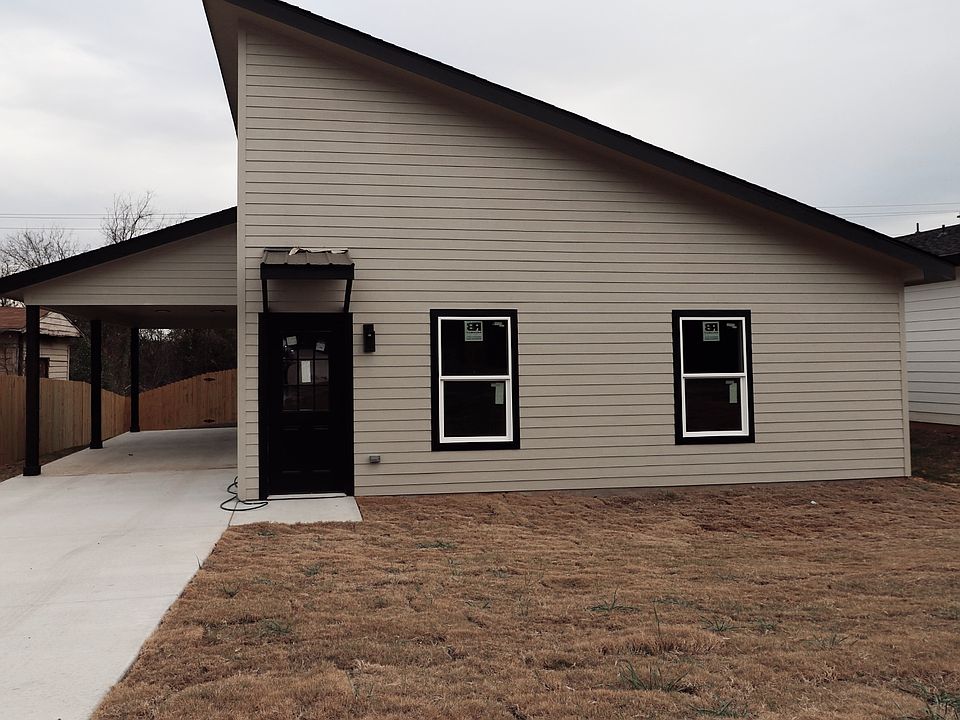 Brand new construction with modern design, private driveway, and clean exterior lines.