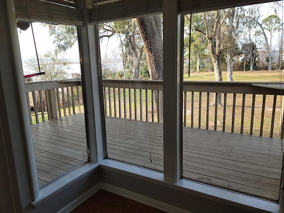 View of deck and bay from the living room