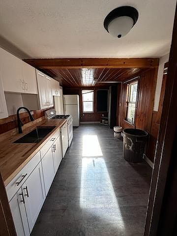 Fully renovated Kitchen with Butcher Block Countertop, large sink and new cabinets