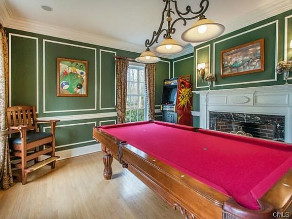 Formal Living Room/Game Room with fireplace and hardwood floorin