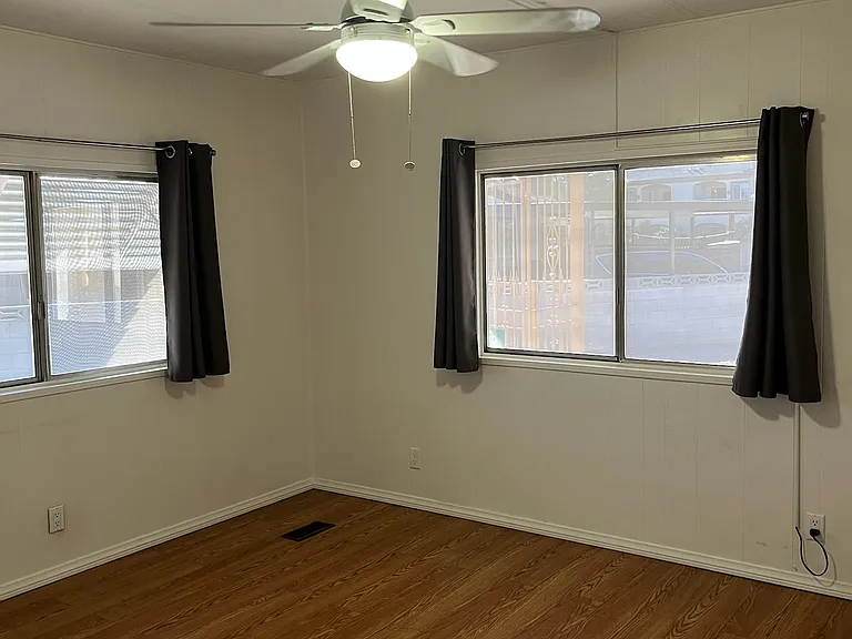 2nd bedroom includes a ceiling fan with overhead lightening