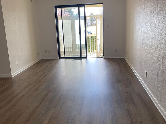 Dining area and a living room with access to the patio