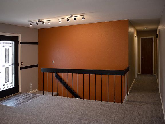 Living Room, hallway to bedrooms and stairs to lower level
