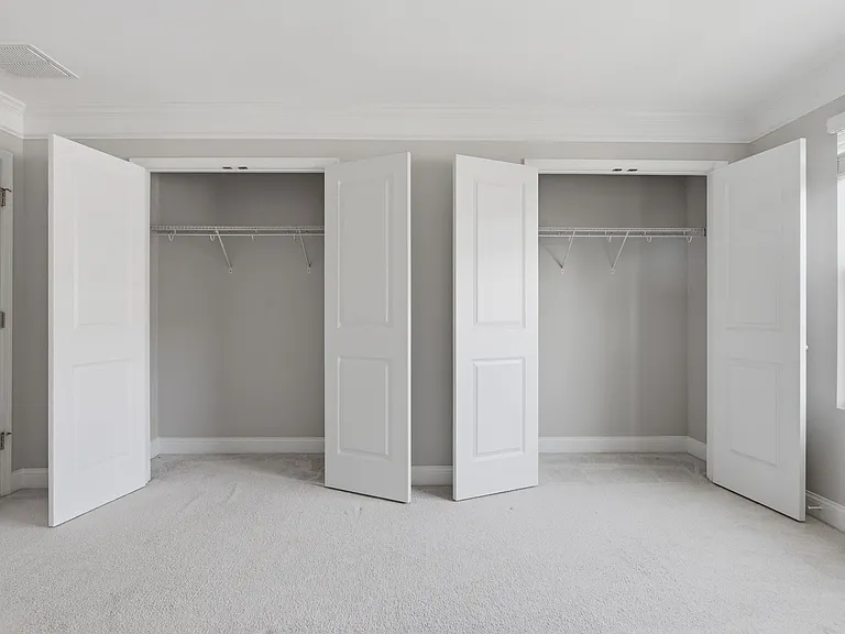 3rd-floor primary bedroom with two closets.