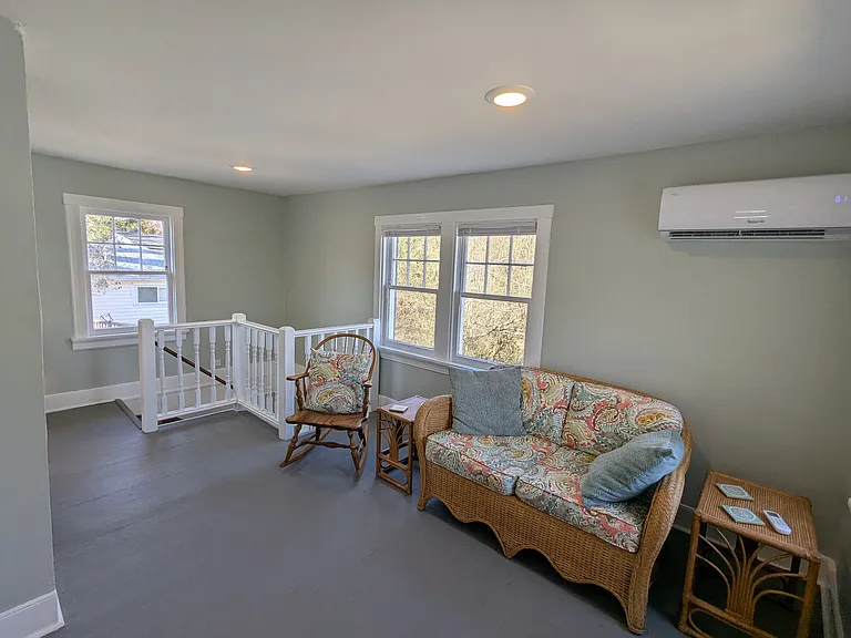 Upstairs living area with exit to screened porch