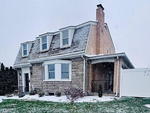 Enclosed covered patio off side of house with door to dining room