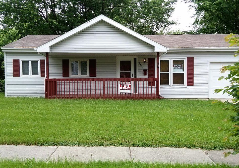Front view with nice covered poarch and yard