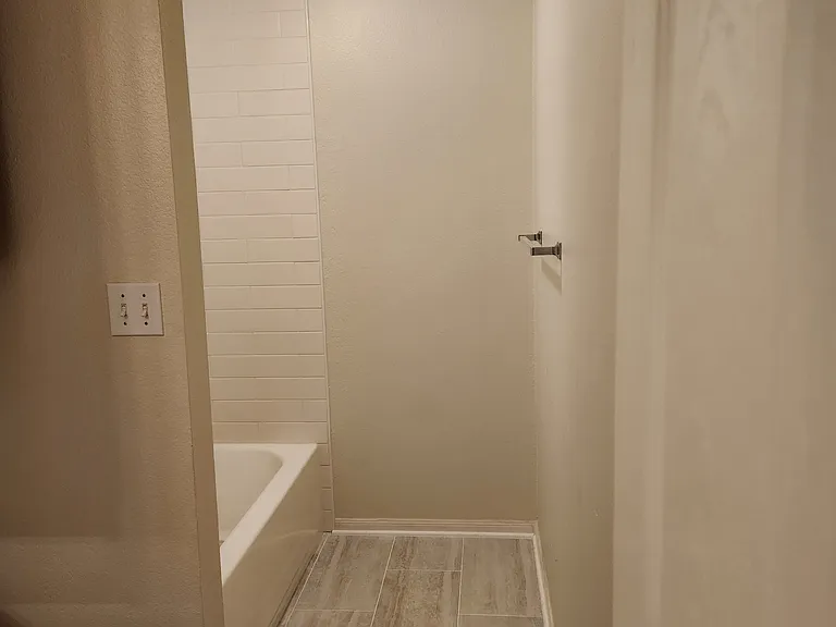 Large Hall Bathroom with tub and shower.