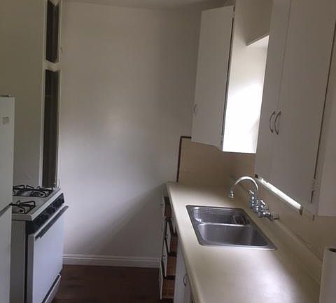 Kitchen with south-facing window to small yard.