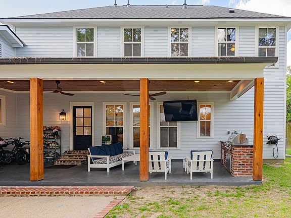 Backyard patio with built-in sink & gas grill. Polywood furniture included in lease. (couch, 2 chairs and coffee table)