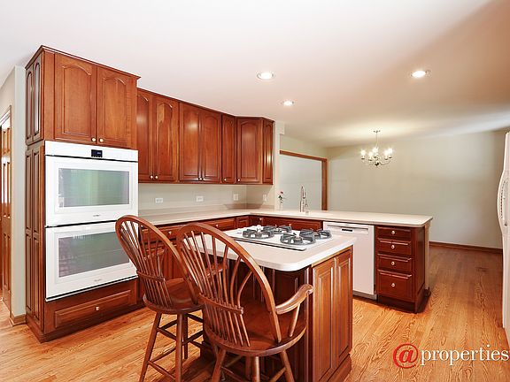 Kitchen: Cherry cabinets + Corian counters