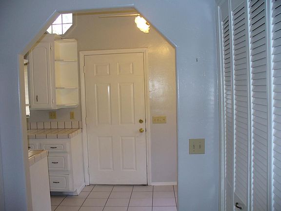 Front Door by Kitchen Eating Area